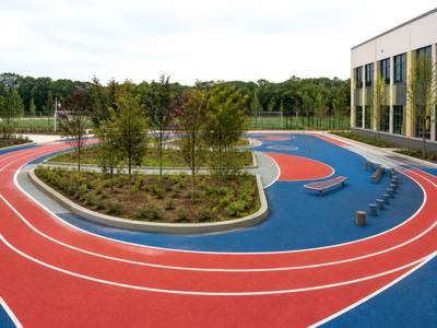 Red rubber running track with white lanes